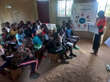 Children attentively listening to the peace trainer